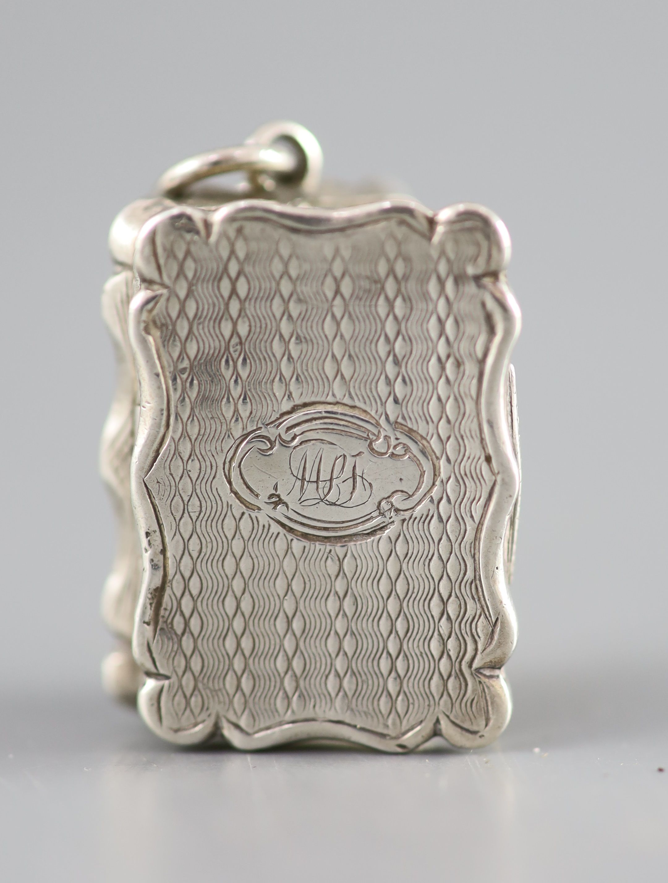 A Victorian silver rectangular vinaigrette, with engine turned ornament and ring, Frederick Marsden, Birmingham, 1860,